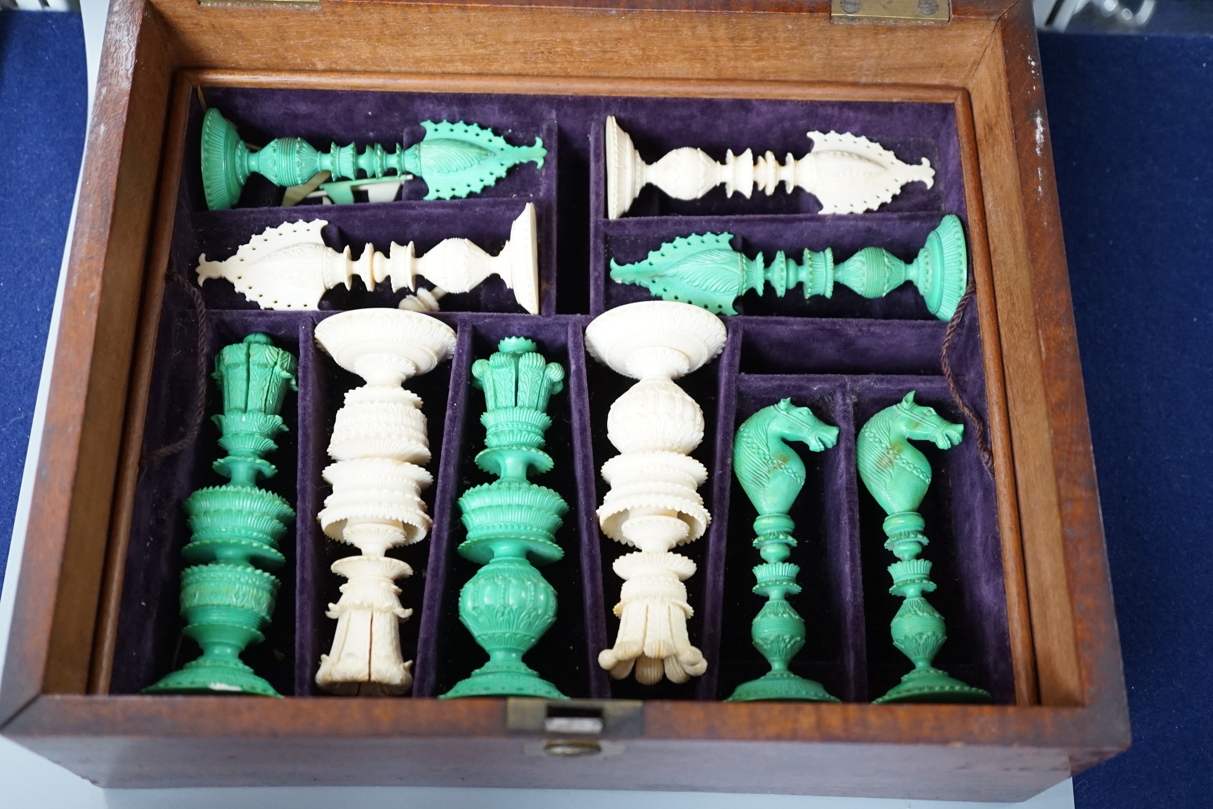 A boxed 19th century Burmese pattern ivory chess set, one pawn restored, king height 11cm